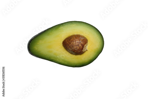 Obraz na płótnie Half avocado with seed isolated on the white background. w salonie