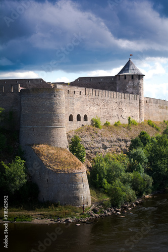 Wallpaper Mural Ivangorod fortress castle situated in Narva northen Estonia by the border of Russia, constructed from stone by German Livonian knights order, surrounded by Narva river Torontodigital.ca