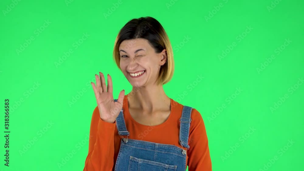 Lovely girl coquettishly smiling, waving hand and showing gesture come here. Green screen Lovely girl coquettishly smiling, waving hand and showing gesture come here. Green screen