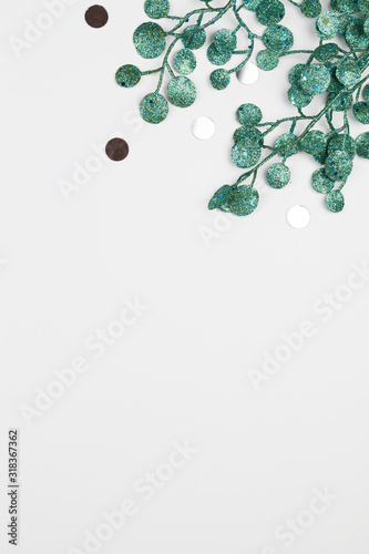 green painted leaves on white background . Creative layout border frame.