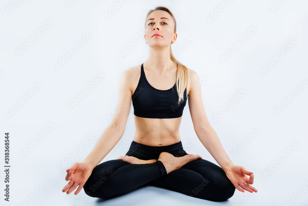 Sport blond girl in tracksuit for sport exercises on a white background Sport blond girl in tracksuit for sport exercises on a white background