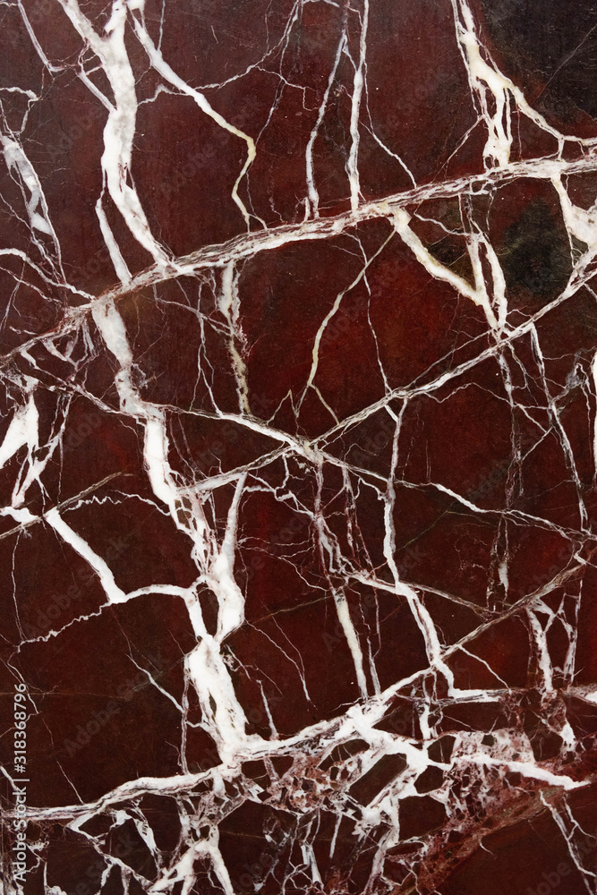 red marble tile with white stripes cracks photo