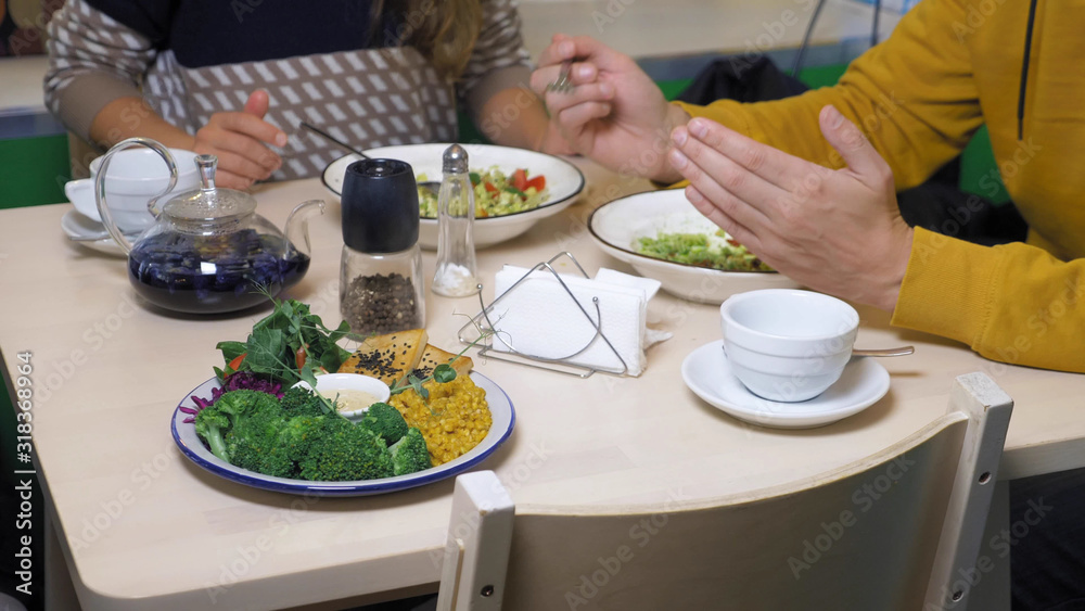 couple man and woman eating in vegetarian restaurants healthy food couple man and woman eating in vegetarian restaurants healthy food