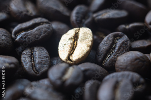 Close-up of the golden bean on roasted coffee background photo