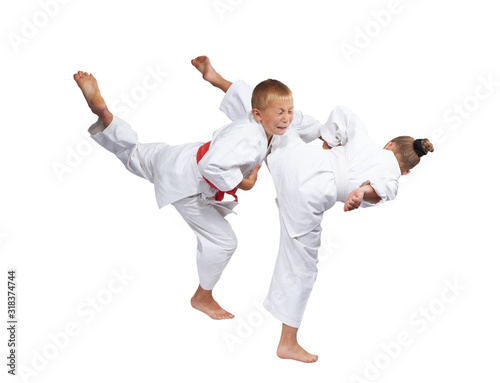 Children in karategi are beating karate blows
