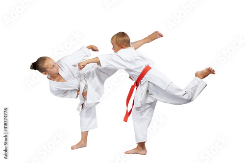 Children in karategi beat karate blows