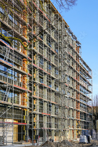 scaffolding arround the house to install thermal insulation of the apartment building facade
