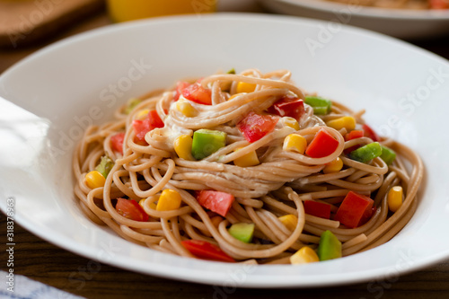 Delicious vegan pasta salad with tahini dressing. Noodles with quinoa or whole wheat pasta.