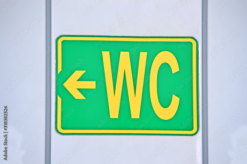 toilet aka water closet, green sign on the wall, daily hygiene sanitary, environment diversity toilet aka water closet, green sign on the wall, daily hygiene sanitary, environment diversity