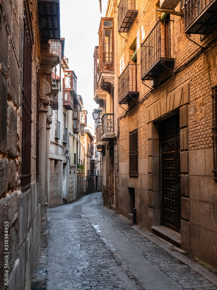 Beautiful streets of the city of Toledo, with balconies and sunny day