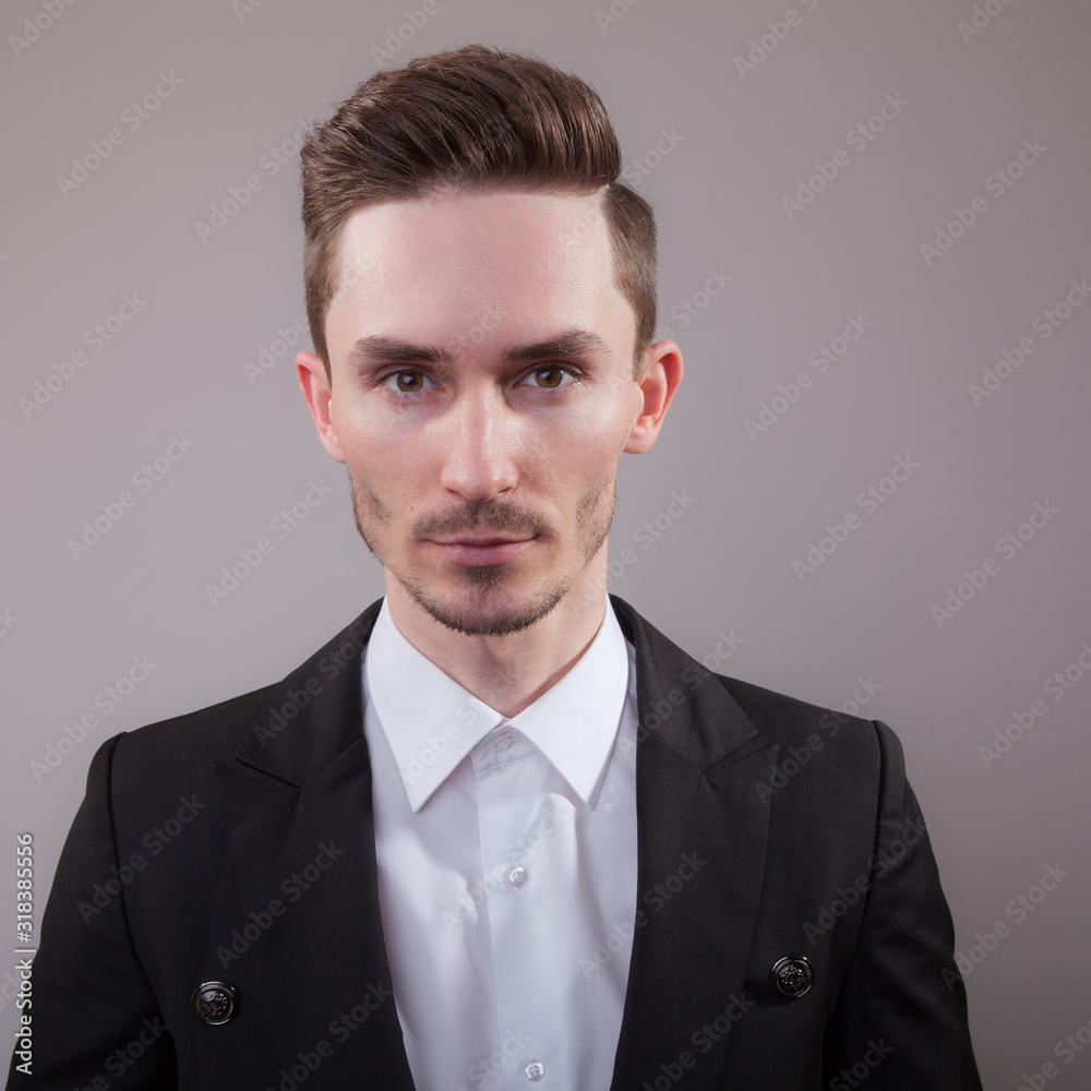 Handsome young elegant man studio portrait. Handsome young elegant man studio portrait.