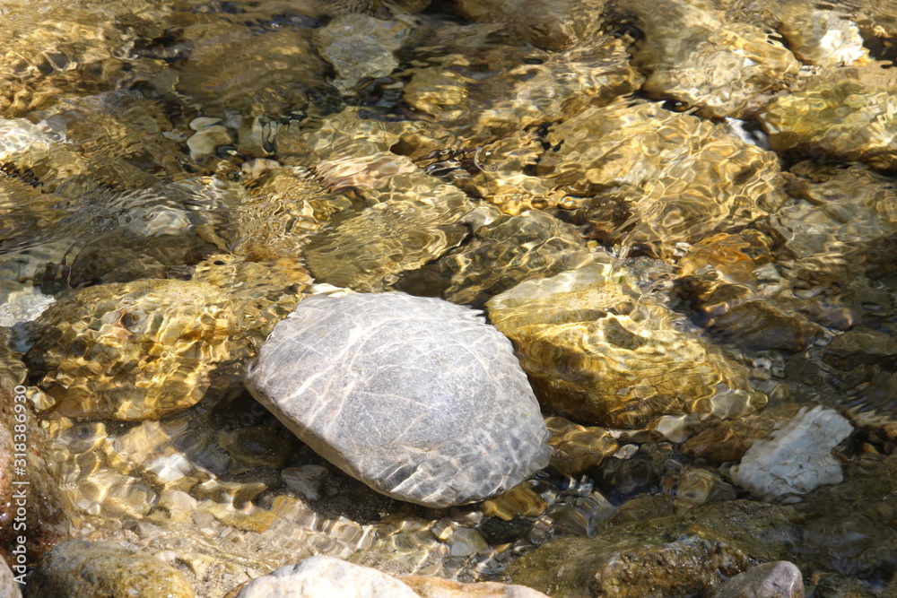 Fototapeta premium Stone below water stream in a river in Hungary.