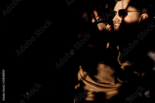 Unusual portrait of young couple on sunset © shunevich