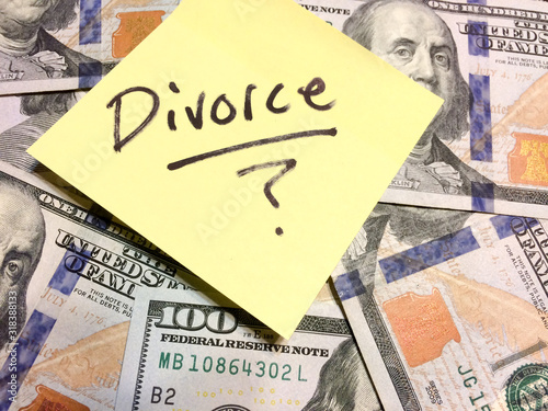 American cash money and yellow post it note with text Divorce with question mark