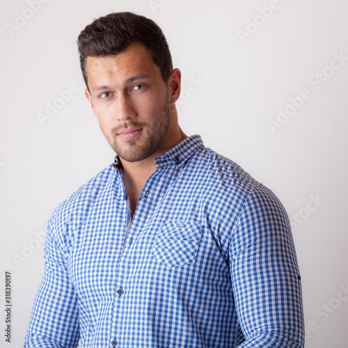 Handsome young elegant man studio portrait.