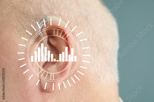 Senior man with hearing aid...