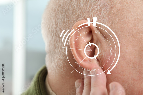 Senior man with hearing pro...