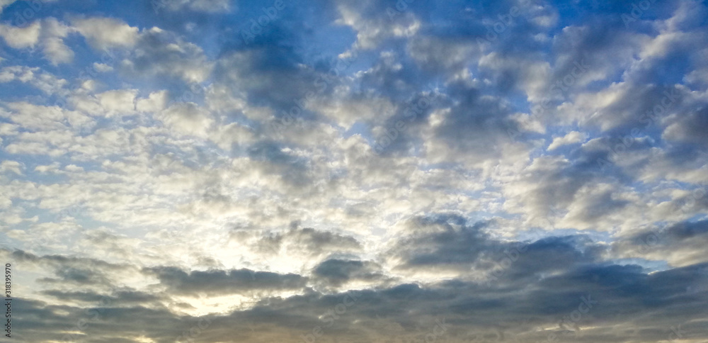 background with blue sky with white clouds on sunset