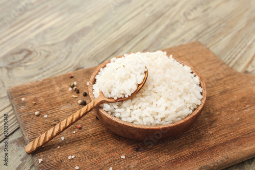 Cooked white rice in wooden...