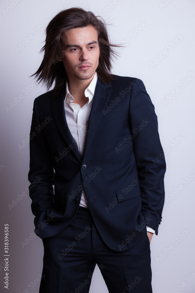 Handsome young elegant man studio portrait.
