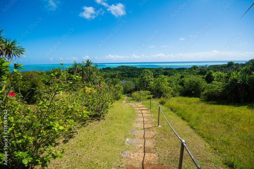 Path way to the stone monoliths, blue ocean, green hill, tropical, Ngarchelong, Palau, Pacific