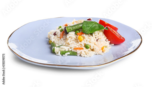 Plate with boiled rice and vegetables on white background