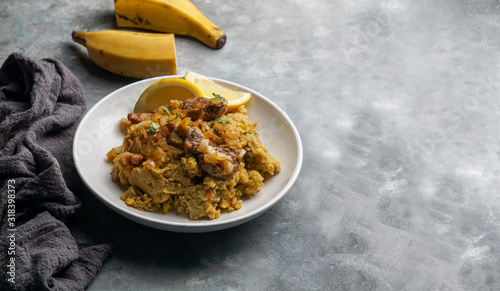 Fufu de platano verde maduro, tacaho, Mofongo, mashed  boiled plantains with porc meat, onion. Puerto Rico.  Amazonian cuisine, Peru, Cuba photo