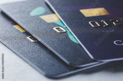 Different credit cards on grey background, closeup
