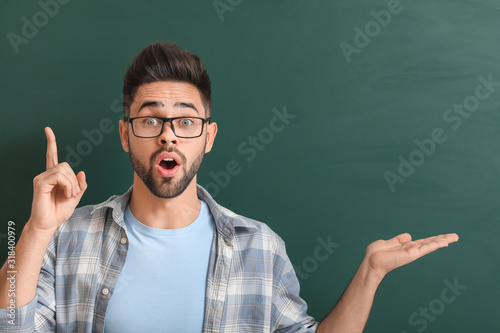 Male teacher with raised in...