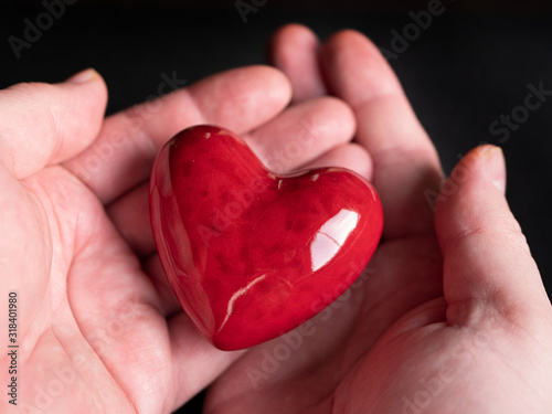 Red heart in the hand. St. Valentine's Day concept idea