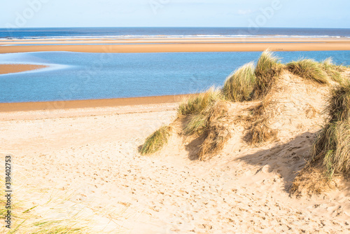 Sand dunes where Norfolk Coast path National Trail from Barnham Overy Staithe reaches the sea