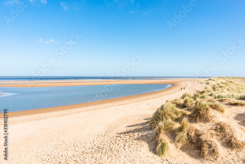 Sand dunes where Norfolk Coast path National Trail from Barnham Overy Staithe reaches the sea  Norfolk  UK.
