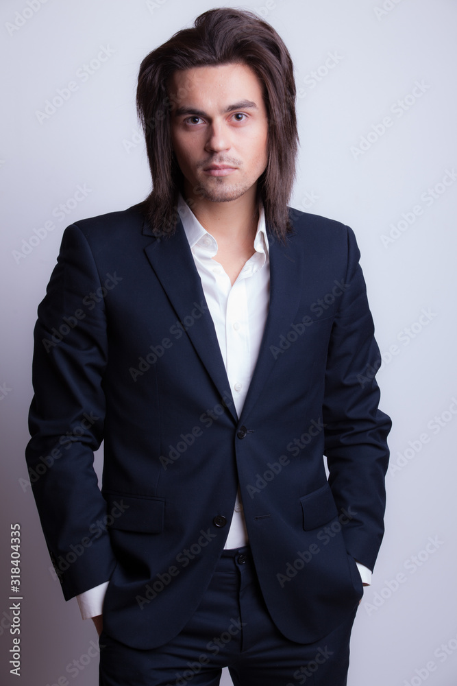 Handsome young elegant man studio portrait. Handsome young elegant man studio portrait.