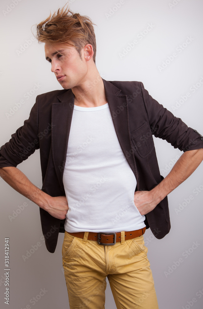 Handsome young elegant man studio portrait. Handsome young elegant man studio portrait.