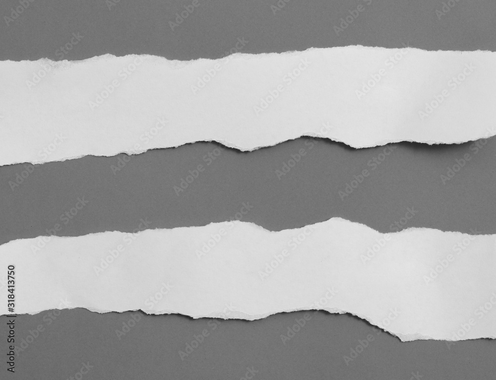 old torn paper on gray background with copy space for text old torn paper on gray background with copy space for text