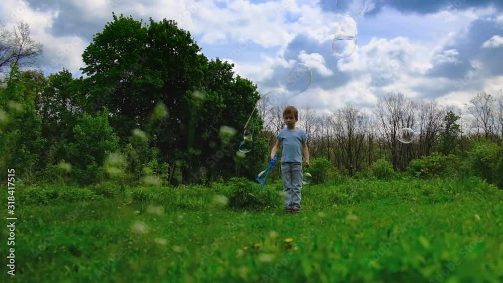 Happy little boy runs and ddancing, lifestyle slow motion video. Child outdoors running on meadow in summer in nature. lifestyle. Happy little boy runs and ddancing, lifestyle slow motion video. Child outdoors running on meadow in summer in nature. lifestyle.