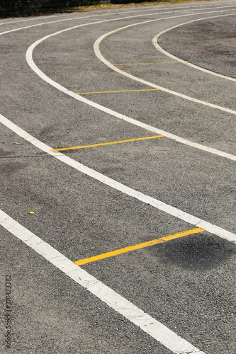 black tarmac asphalt of running track, athletic sport background © sutichak