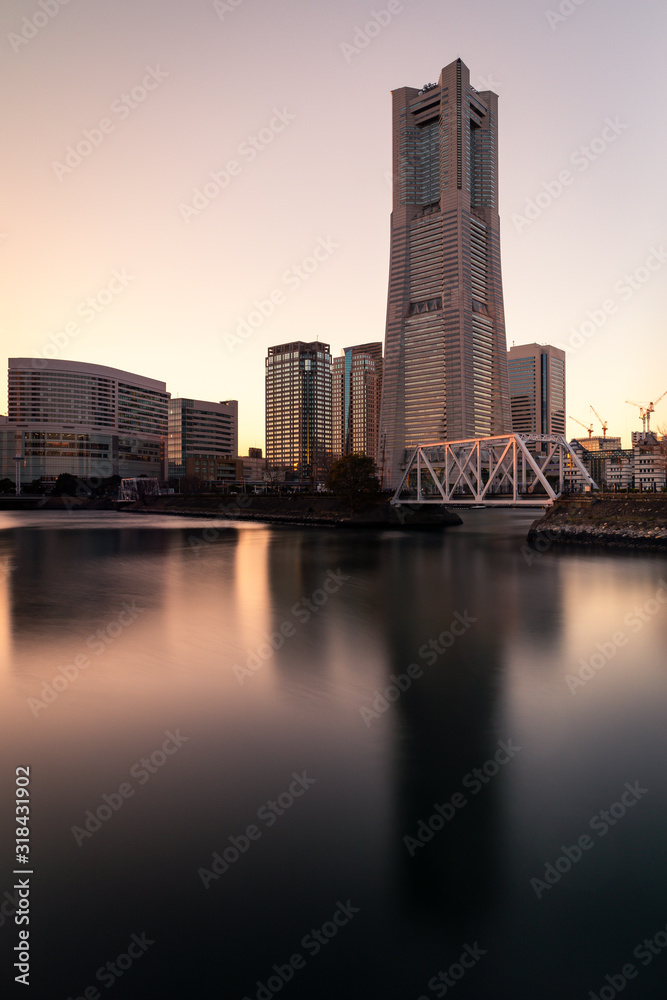 Naklejka premium View at the waterfront in Minato Mirai, Yokohama during winter. Portrait orientation.