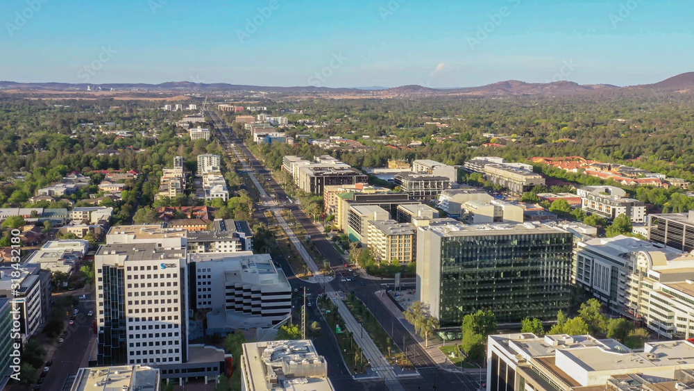 Fototapeta premium Panoramic aerial view of Canberra City, the capital of Australia, looking north over Northbourne Avenue on a sunny afternoon 