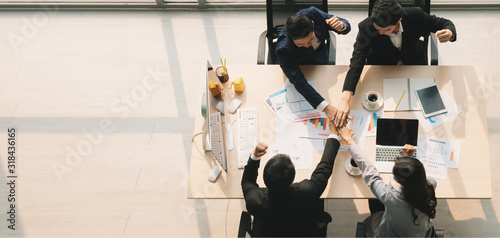 business background of group of business people having hands stack together to cheer up team spirit and teamwork to success