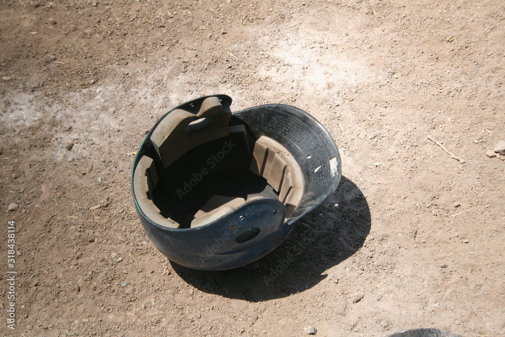 baseball helmet lying on the ground floor