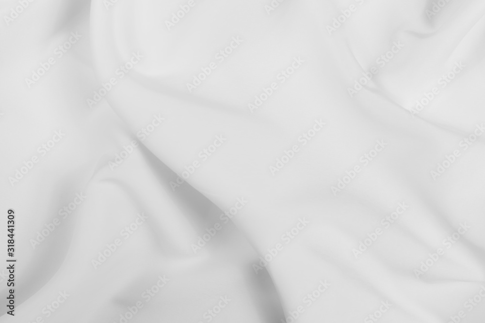 Abstract white fabric texture background. Cloth soft wave. Creases of satin, silk, and cotton.	