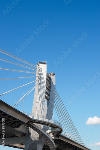 Part of metal bridge construction.Part of the big City Bridge on blue sky background. Copy space. road for transport. Metal Construction. Modern Architecture. Urban style.