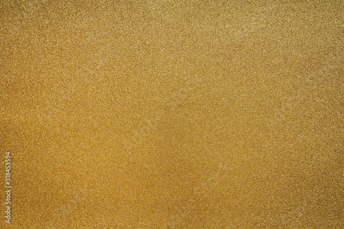 Fine Detailed texture of glittering golden dust surface