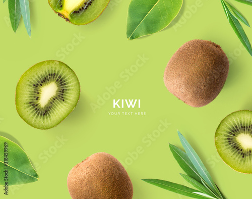 Fototapeta Creative layout made of kiwi and leaves