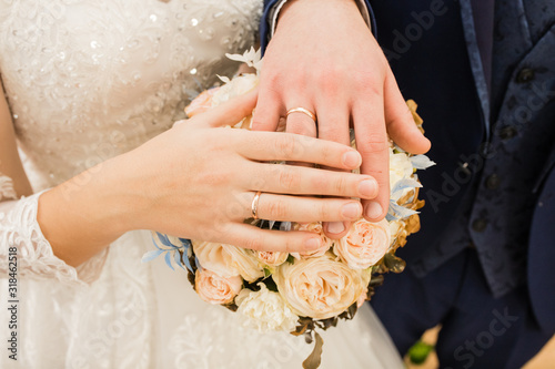 Wallpaper Mural wedding rings on your hand. Newlyweds put their hands on the wedding bouquet, showing off their wedding rings. Torontodigital.ca
