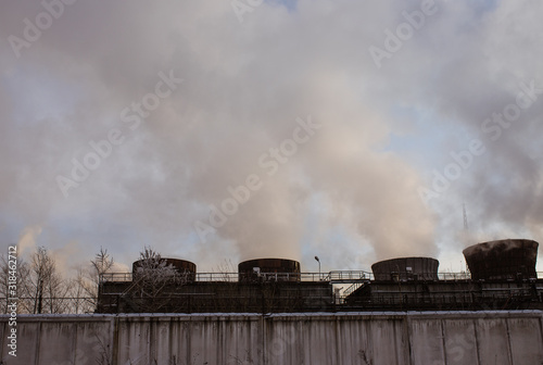 environmental pollution. smoke is coming. air pollution. pipes at the factory. Smoking pipes of thermal power plant on sunset © Dima