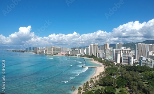Drone aerial panorama view of Waikiki beach Honolulu Hawaii USA golden beaches turquoise beach lush green palms with hotels resorts in background 