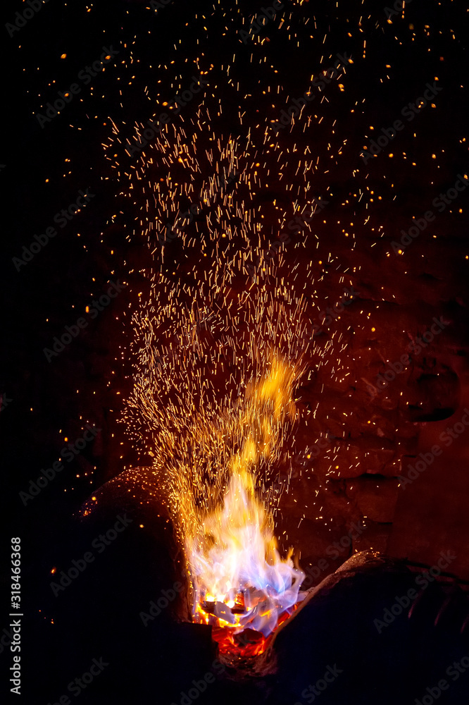 Sparks of a fire on a black background
