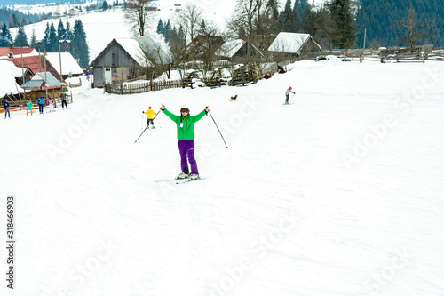 A man is skiing in the Carpathian village.